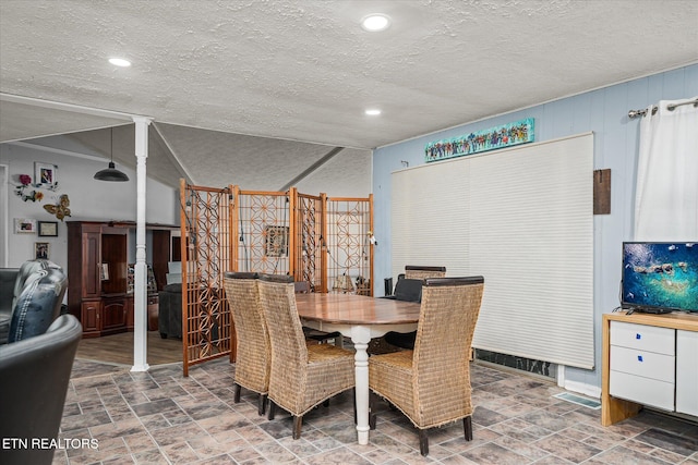 dining area with a textured ceiling