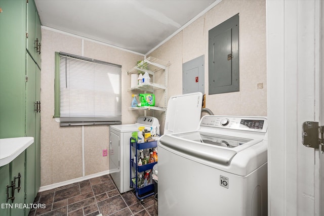 laundry room featuring electric panel, washer and clothes dryer, and ornamental molding