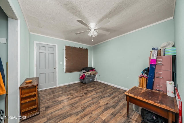 miscellaneous room with ceiling fan, dark hardwood / wood-style flooring, a textured ceiling, and ornamental molding