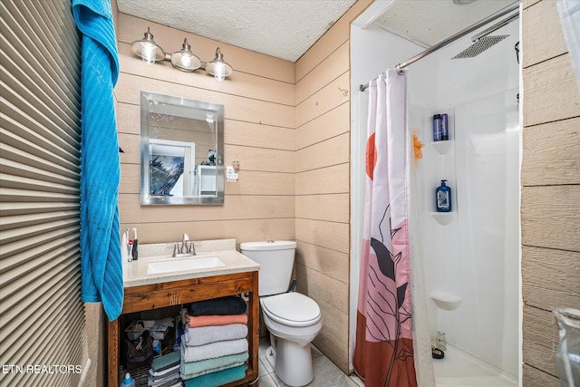 bathroom featuring wooden walls, toilet, a textured ceiling, and walk in shower