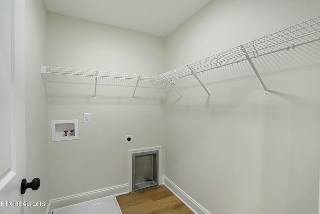 laundry area featuring hookup for a washing machine, hardwood / wood-style floors, and hookup for an electric dryer