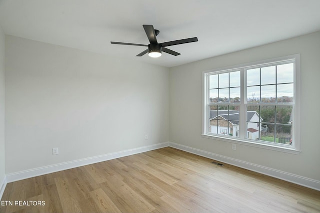 unfurnished room with light hardwood / wood-style floors and ceiling fan