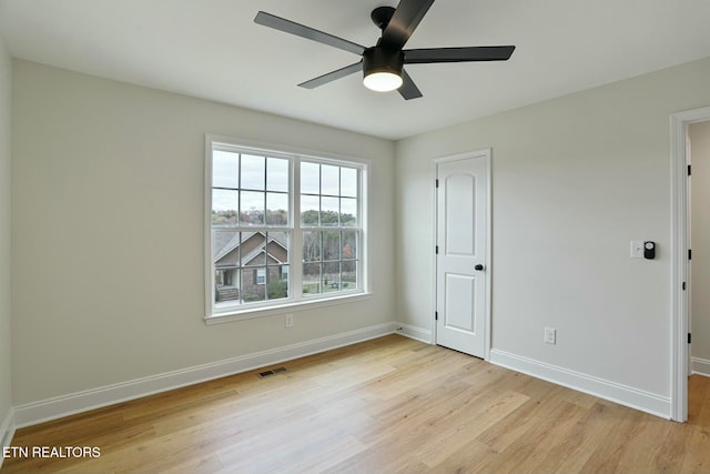 unfurnished room featuring ceiling fan and light hardwood / wood-style floors