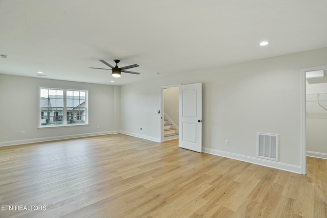 unfurnished room featuring ceiling fan and light hardwood / wood-style flooring