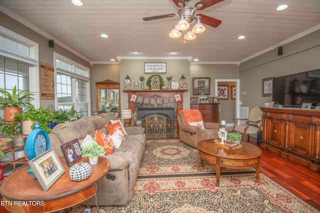 living room featuring hardwood / wood-style flooring, ceiling fan, ornamental molding, and wood ceiling