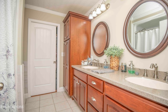 bathroom with double vanity, ornamental molding, tile patterned flooring, and a sink