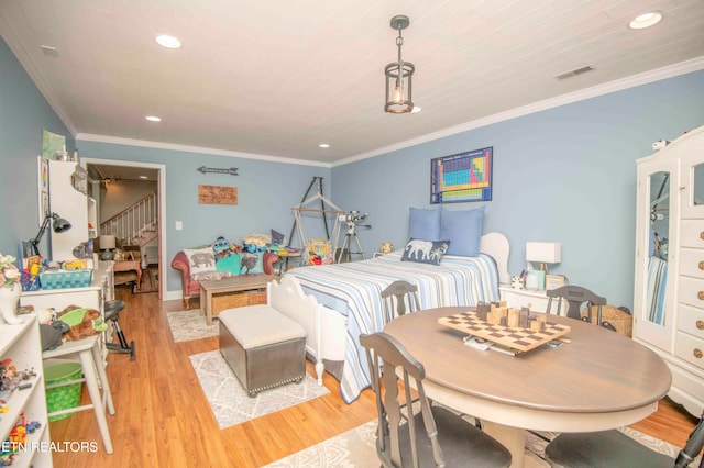 bedroom with ornamental molding, recessed lighting, visible vents, and light wood-style floors