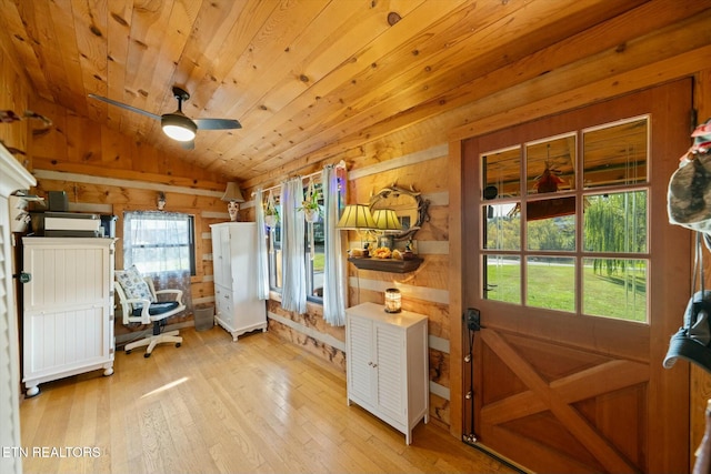 kitchen with ceiling fan, light hardwood / wood-style flooring, lofted ceiling, wooden walls, and wood ceiling