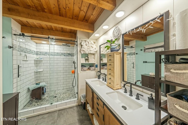 bathroom with beamed ceiling, tile patterned floors, a shower with door, vanity, and wood ceiling