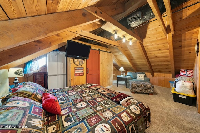 carpeted bedroom with vaulted ceiling with beams, wooden walls, wood ceiling, and a barn door