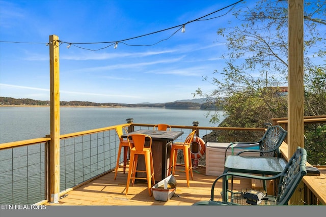 deck featuring a water view