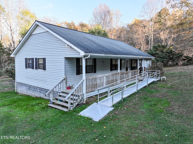 view of front of house featuring covered porch and a front lawn