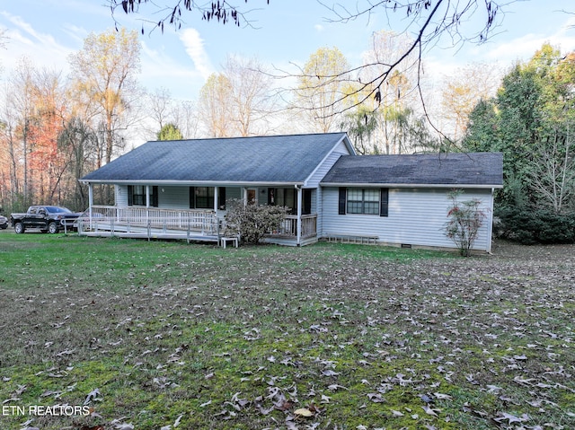 ranch-style home with a porch and a front lawn