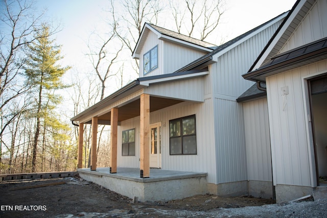 view of property exterior with covered porch