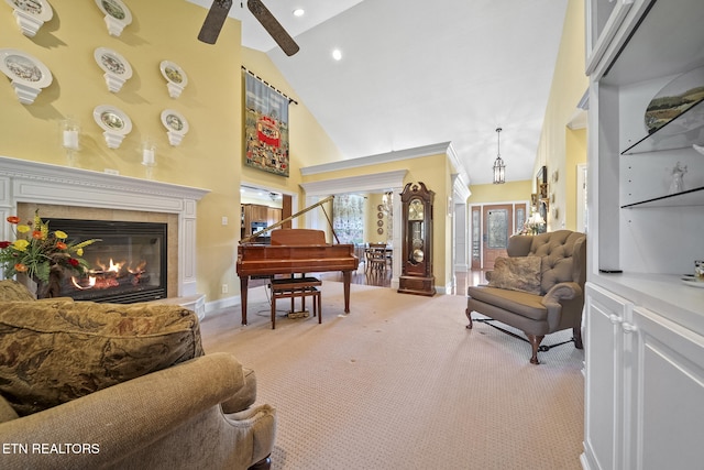 living area with light carpet, a fireplace, high vaulted ceiling, and ceiling fan