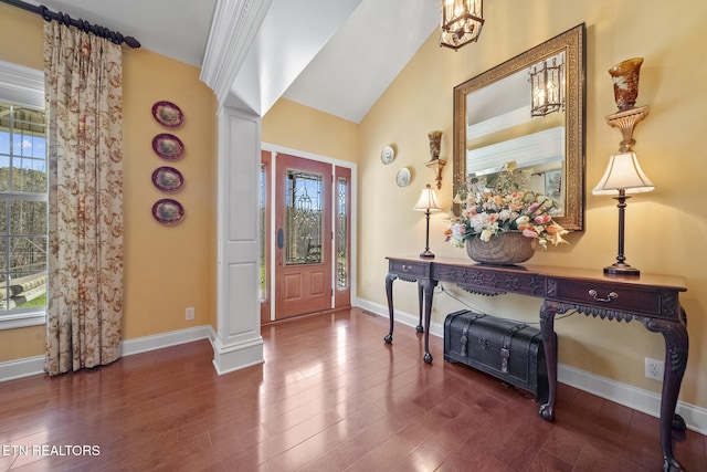 entryway with lofted ceiling, a wealth of natural light, and dark hardwood / wood-style floors