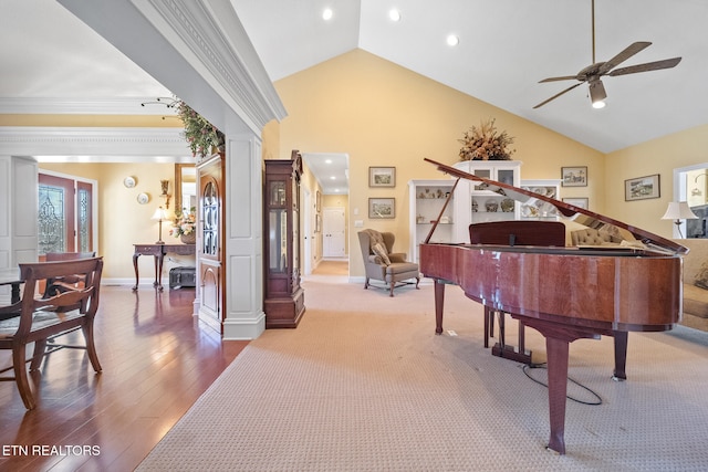 misc room with hardwood / wood-style flooring, high vaulted ceiling, ceiling fan, and crown molding