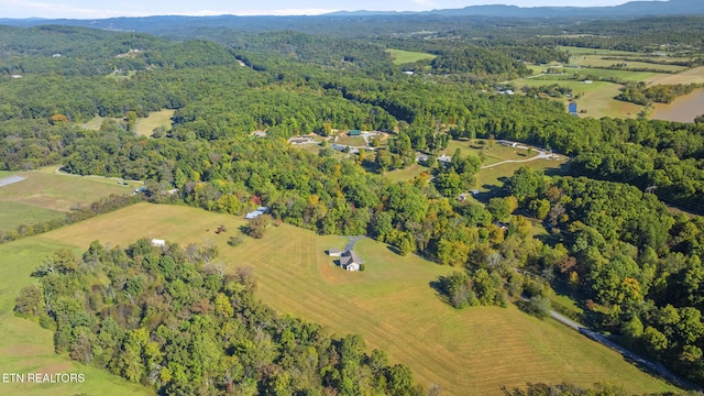 birds eye view of property with a rural view