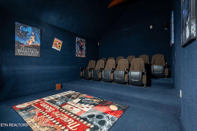 home theater featuring carpet floors and vaulted ceiling