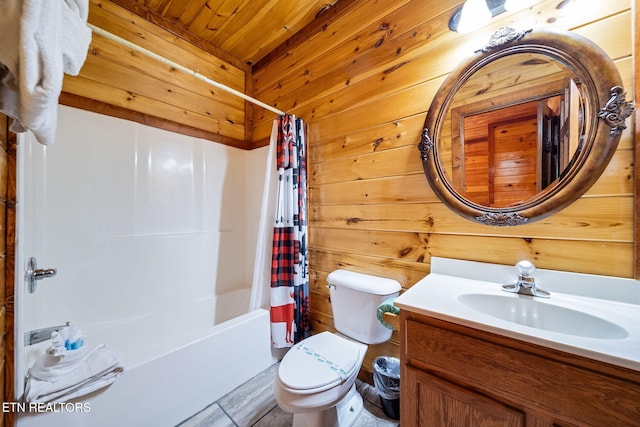 full bathroom with tile patterned floors, wood ceiling, vanity, shower / bath combo with shower curtain, and toilet