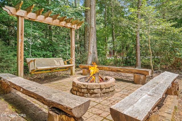 view of patio with an outdoor fire pit