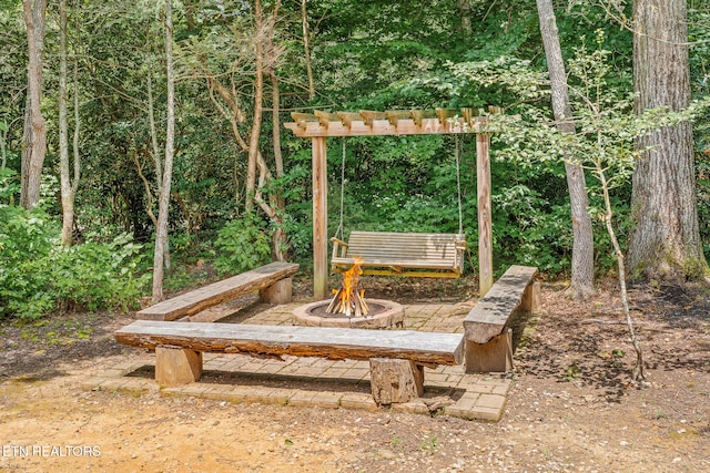 view of yard featuring an outdoor fire pit