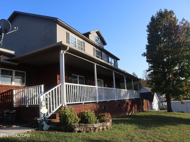 view of property exterior with a storage shed and a lawn