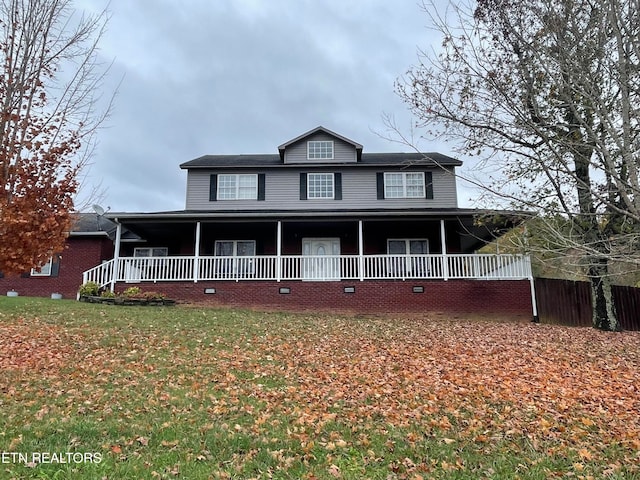 country-style home with a front lawn