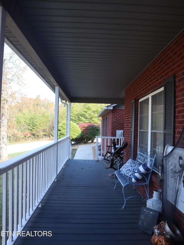 wooden terrace with covered porch