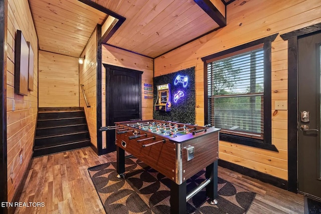 playroom with hardwood / wood-style flooring, lofted ceiling, wood walls, and wood ceiling