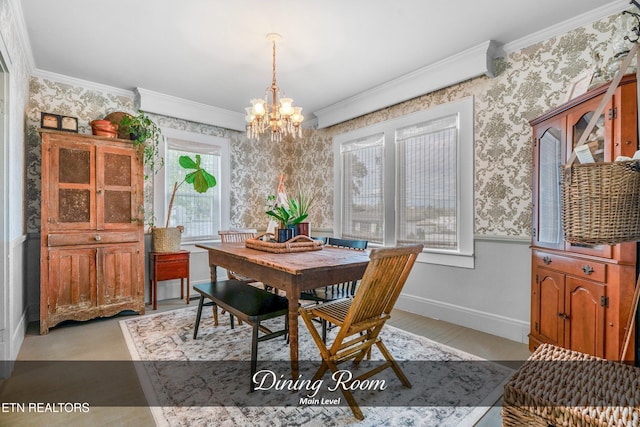 dining room with a chandelier and crown molding