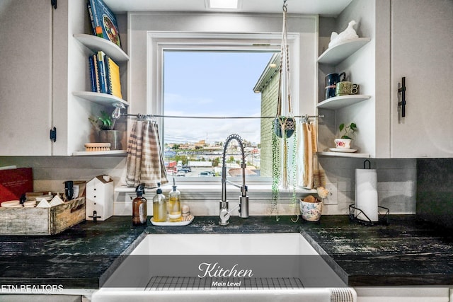 kitchen with decorative backsplash and sink