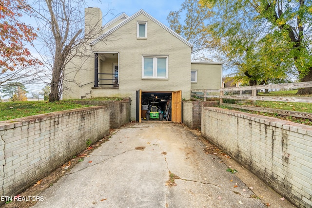 view of side of property featuring a garage