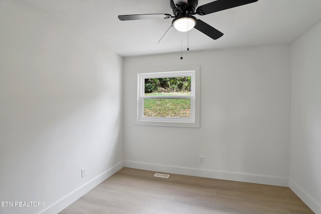 unfurnished room featuring light wood-type flooring and ceiling fan