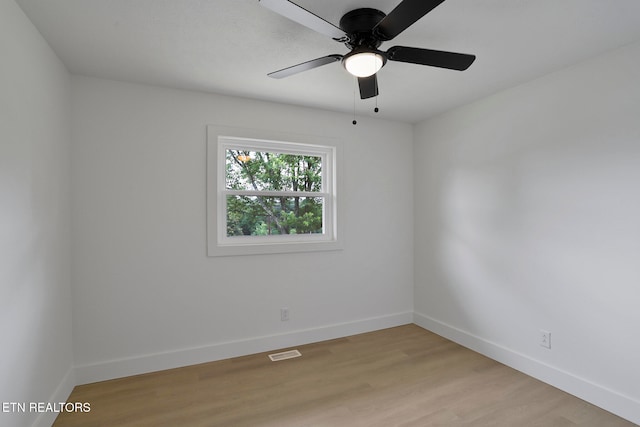 unfurnished room with light hardwood / wood-style flooring and ceiling fan