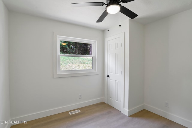 unfurnished room with ceiling fan and light hardwood / wood-style floors