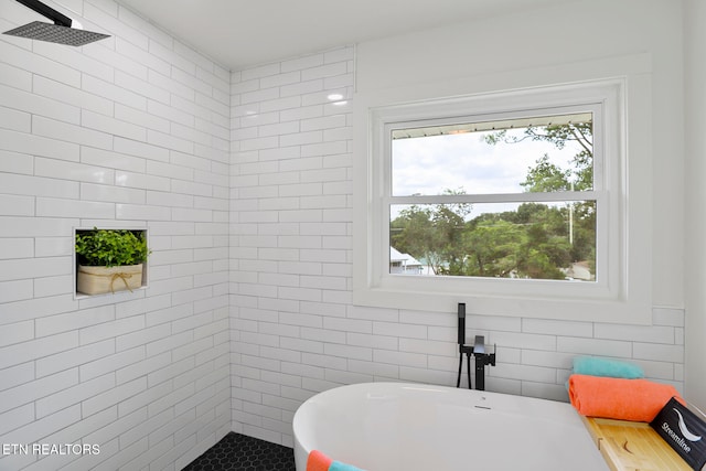 bathroom with separate shower and tub and tile walls