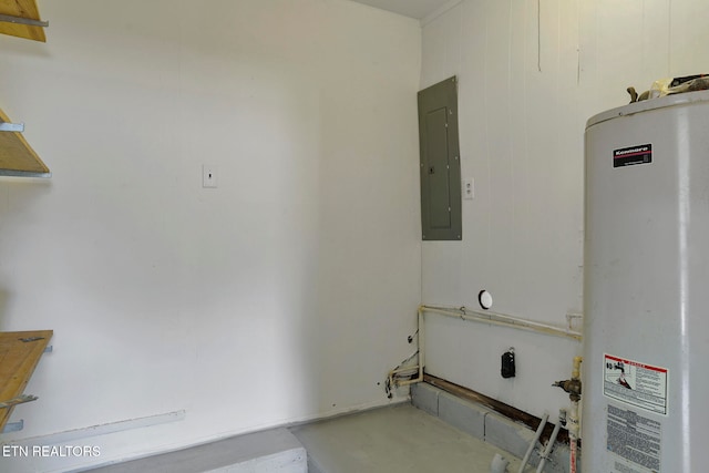 laundry room featuring electric panel, gas water heater, and wooden walls