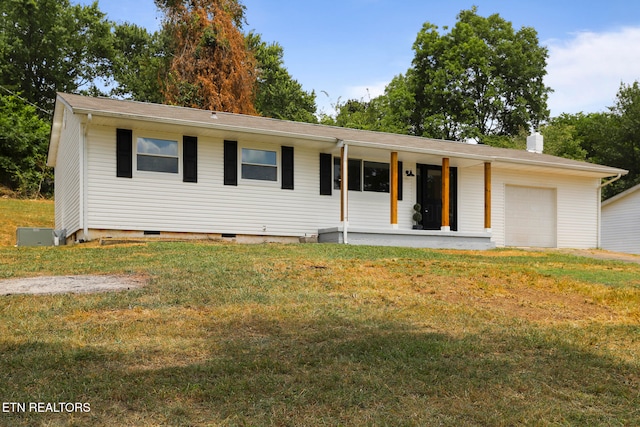 single story home featuring a garage, covered porch, and a front yard