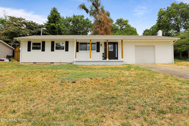 ranch-style home with a front yard, a porch, and a garage