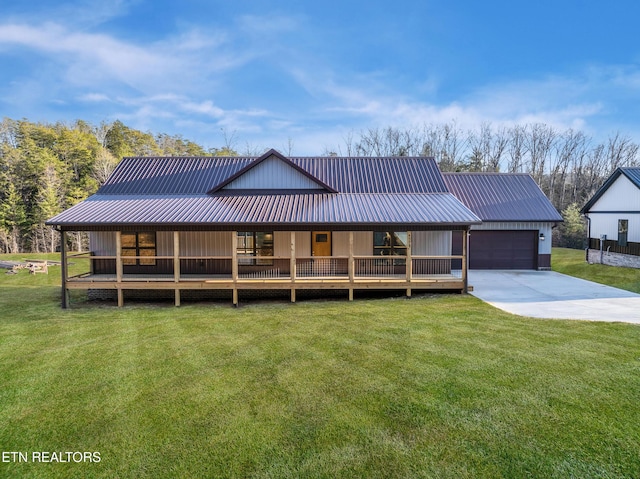 farmhouse inspired home with a garage and a front yard