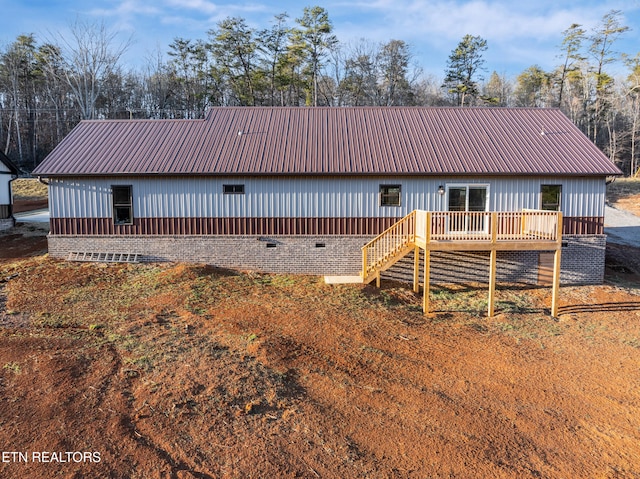 back of property featuring a deck