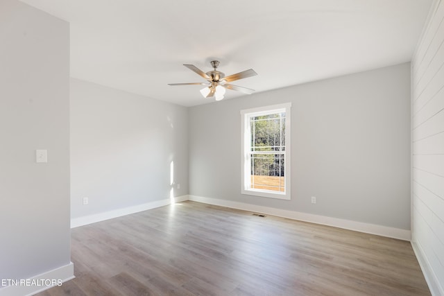 unfurnished room featuring ceiling fan and light wood-type flooring