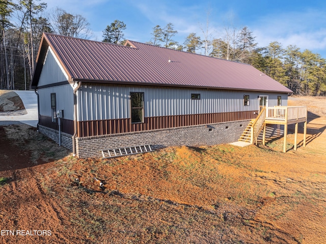 rear view of property with a deck