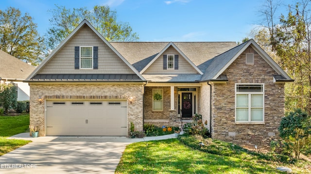 craftsman-style home with a front yard and a garage