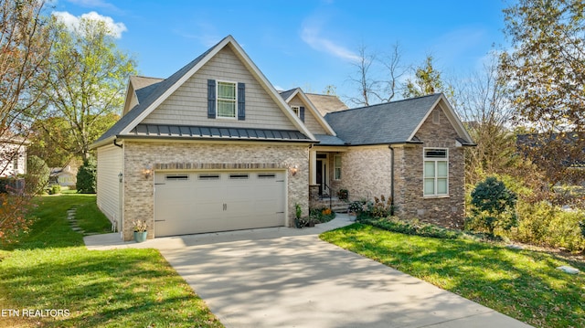 view of front of property with a garage and a front lawn