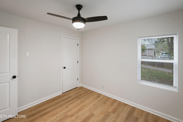 unfurnished room with ceiling fan and light hardwood / wood-style flooring