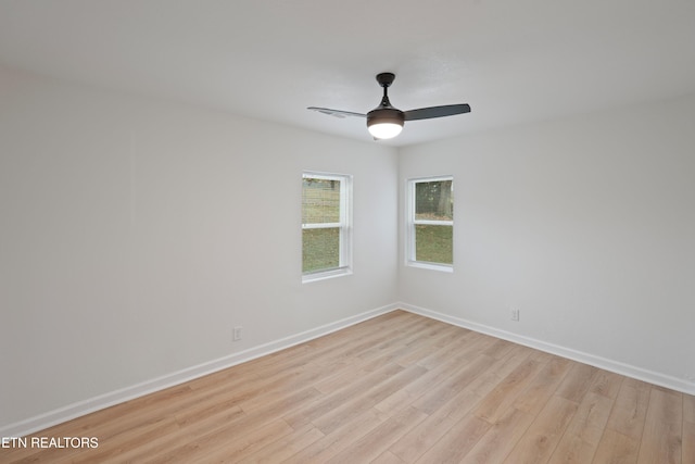 unfurnished room with light wood-type flooring and ceiling fan