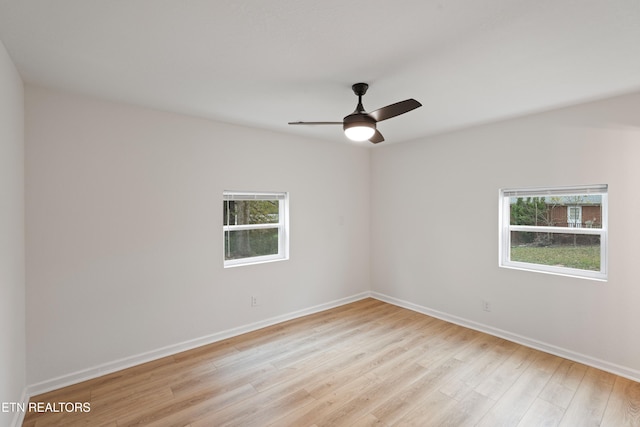 empty room featuring light wood-type flooring and ceiling fan