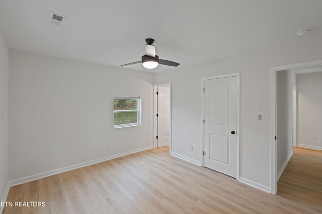 unfurnished bedroom with ceiling fan and light hardwood / wood-style floors